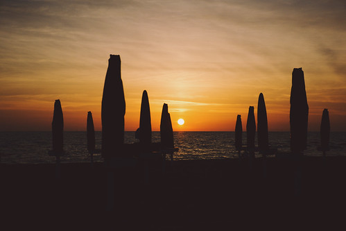 sunset sea summer sky orange sun sunlight beach silhouette clouds landscape reflex nikon colorful fav50 horizon summertime dslr umbrellas parasols kodakportra400nc appleaperture fav10 fav25 fav100 skyporn vsco d5200 afsdxvrzoomnikkor18105mmf3556ged nikond5200 vscofilm