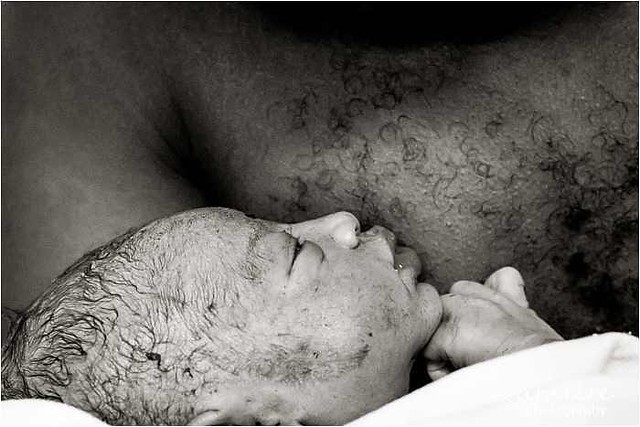 Skin to skin baby with daddy. Just born.