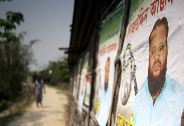 A poster of AIUDF candidate Sirajuddin Ajmal is seen on the wall of a makeshift house on the embankment.