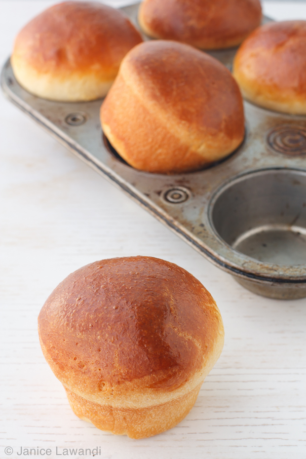 Brioche buns baked in a muffin pan until golden brown and ready to eat.