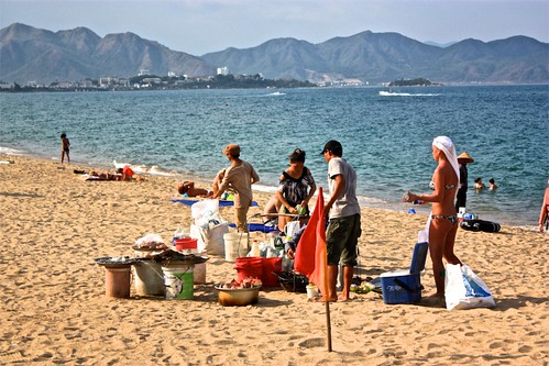 People huddle around a mobile seafood "restaurant" in Nha Trang