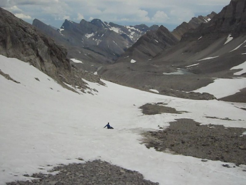 Vicki glissading on the soft snow below the headwall of Bonnet Glacier