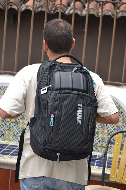 a guy wearing a Thule Backpack on his back