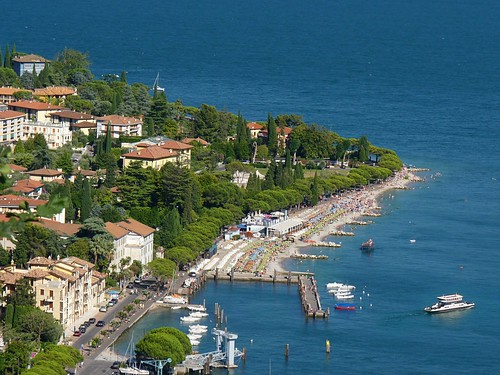 blue trees summer vacation italy foothills lake holiday mountains alps west green beach church water sport swimming fun boats coast harbor town topf50 bars garda mediterranean kayak italia sailing view outdoor speedboat restaurants visit spot adventure rowing cypress picturesque climate pleasure gardameer mild lombardy isoladelgarda toursim maderno 50faves toscolano maclino residenceilimonidirustichel