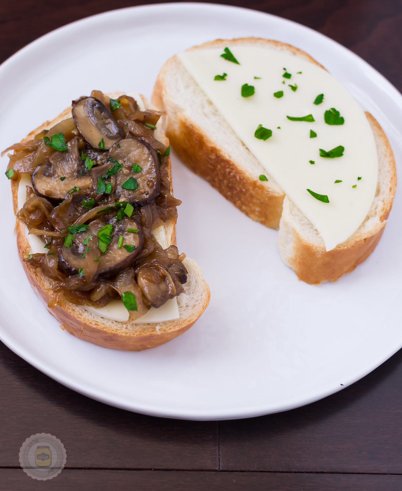 bread with cheese, caramelized onion and mushrooms before grilling