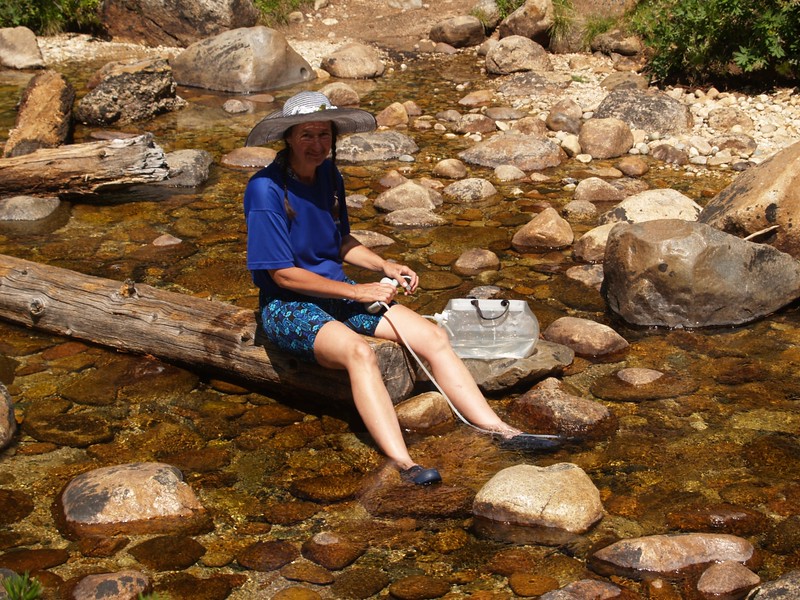 Vicki filtering water from Spiller Creek as we prepare to ascend the PCT toward Miller Lake