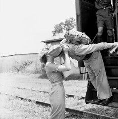 Beth Brown and Marine Corporal Travis Taylor kissing goodbye at the train depot in Tallahassee, Florida