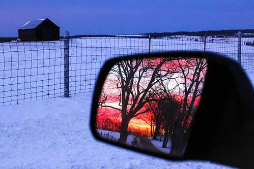 winter sunset red orange sun snow cold reflection car barn truck mirror