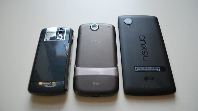 Blackberry Pearl 8100, HTC Nexus One, and LG Nexus 5 phones viewed from the back