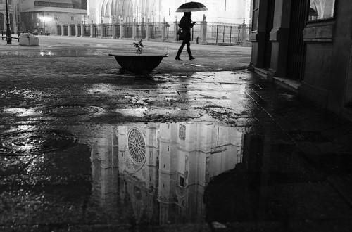 street light blackandwhite bw woman snow reflection wet silhouette night contrast umbrella puddle photography photo noir cathedral snowing urbanlandscape raulvillalon nikond5100