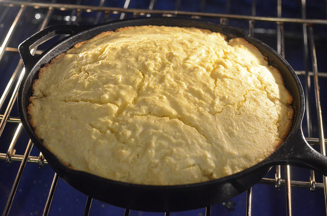 Cornbread in a cast iron skillet in the oven.