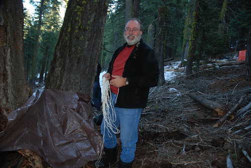 Dave Kreft, with NRCS in Washington, found the perfect out-of-the-wind spot for his shelter before he tackled his tangled rope. NRCS photo by Anita Brown.