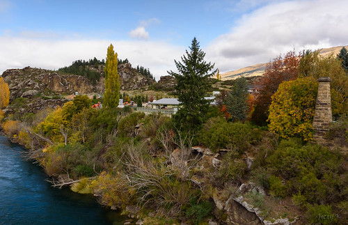 autumn trees newzealand sky water clouds buildings river landscape hills southisland centralotago rune roxburgh cluthariver tripdownsouth teviotvalley