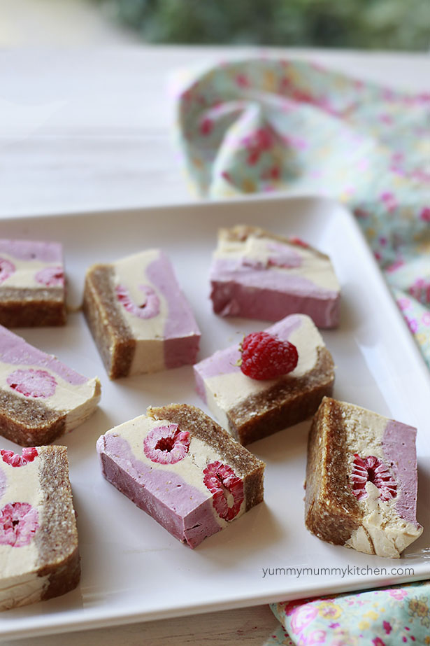 Beautiful vegan raspberry cheesecake slices on a platter. 