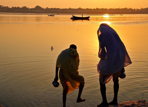 travel light people india water silhouette sunrise river boats asia religion sari ganga ganges uttarpradesh kumbhmela