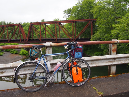 railroad bridge bicycle stormyskies