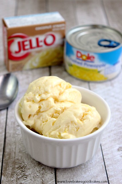 Easy Piña Colada Ice Cream in a bowl close up with a can of dole pineapples and a box of jello in the back ground. 