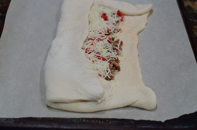 The sides of dough are folded over ingredients.