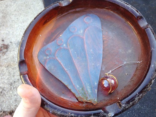 Found in the Melting Snow: A Butterfly Wing, a Mystical Ball, an an Ashtray