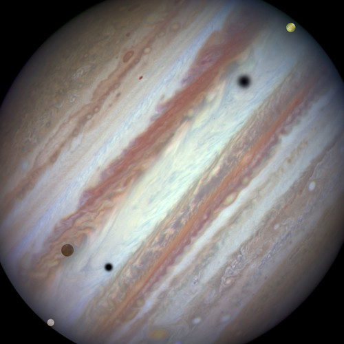 Hubble Captures Rare Triple-Moon Conjunction