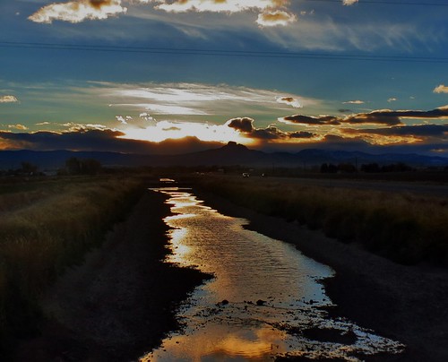 winter sunset sun mountains fall clouds basin canals drain powell wyoming bighorn irrigation mountian