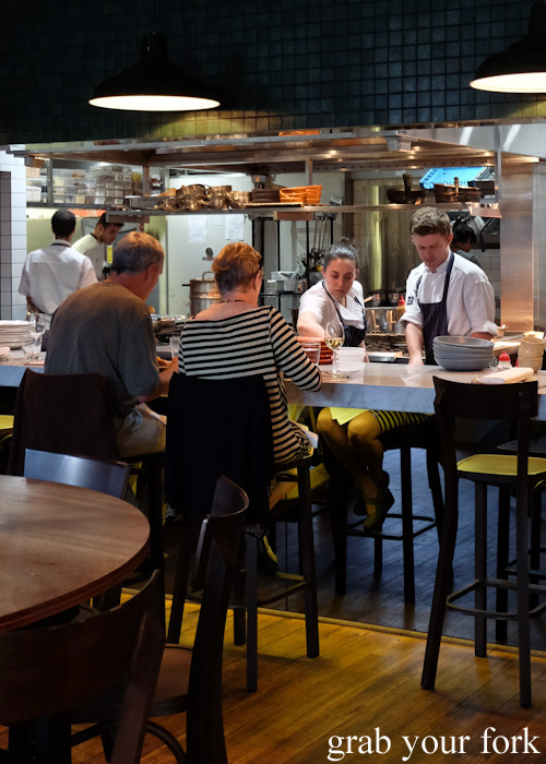 Diners at the kitchen counter at 4Fourteen, Surry Hills
