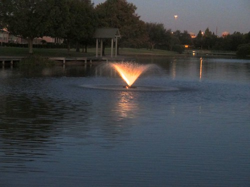 sunset lake fountain twilight texas waterfeature sugarland lightedfountain fishingdock ahobblingaday colonylakes eveningquiet