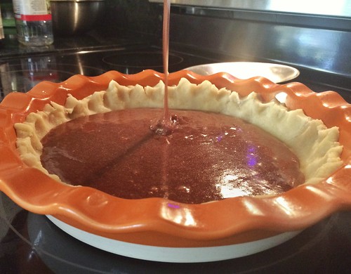 pouring the filling for chocolate chess pie