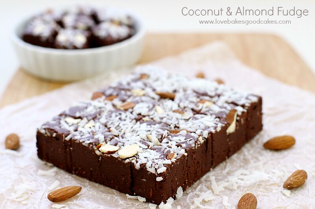 Coconut and Almond Fudge on parchment paper with almonds laying around it.