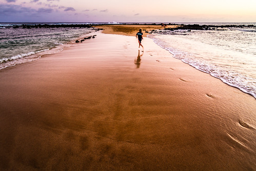 ocean travel sunset beach island hawaii kid sand waves break child pacific board footprints wave running run explore kauai poipu hi decisivemoment keoniloa gohawaii explore20141027