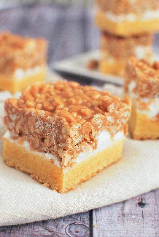 Salted Nut Roll Bars - marshmallows, peanut butter, peanuts, and Rice Krispies! It starts with a box of cake mix so it's a quick and easy dessert! 