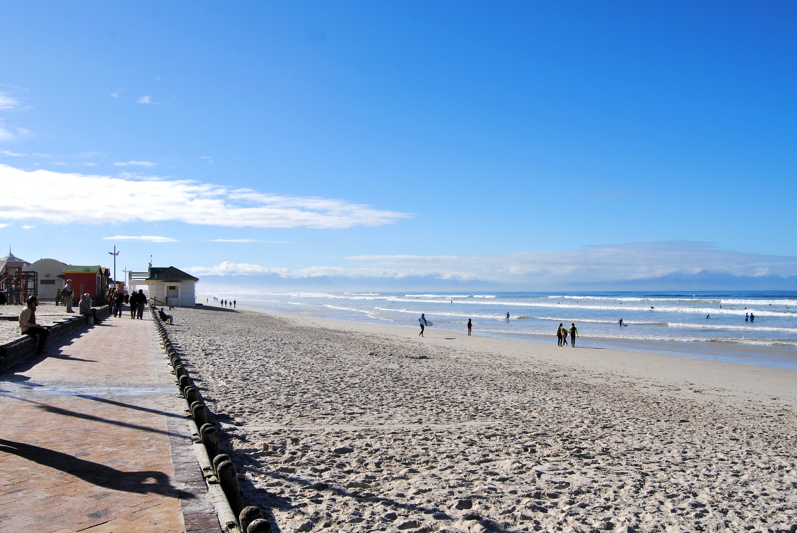 Surfers at Muizenberg Beach, South Africa.