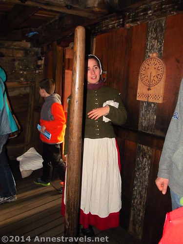 A female costumed interpreter on the Mayflower II, Plymouth, MA