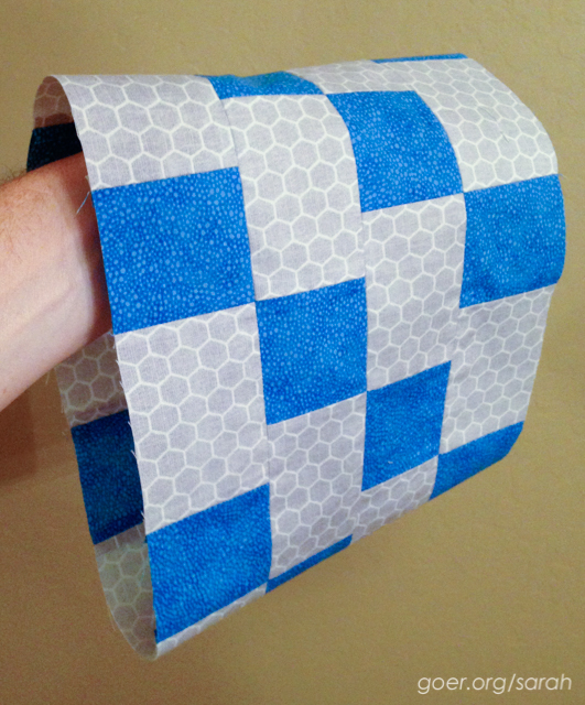 strip pieced tube of blue and grey fabric