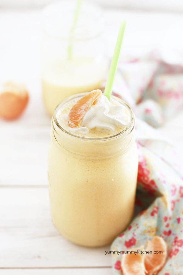 A delicious creamy orange smoothie recipe topped with whipped cream 