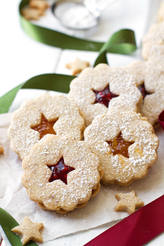 Raspberry Almond Linzer Cookies - Almond shortbread cookies sandwiched together with raspberry jam in the center. These cookies are sooo good! | Littlespicejar.com