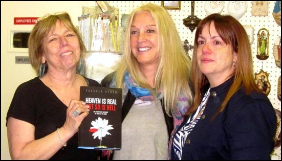 < Sarah holding Vassula’s book “Heaven is Real But so is Hell”