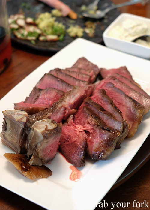Grain-fed dry-aged T-bone steak charred with a Searzall
