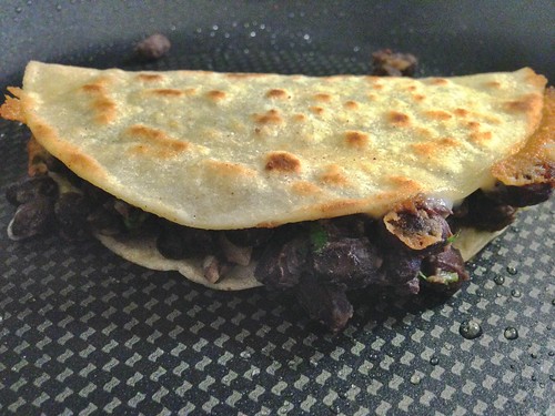 crunchy black bean tacos in the pan