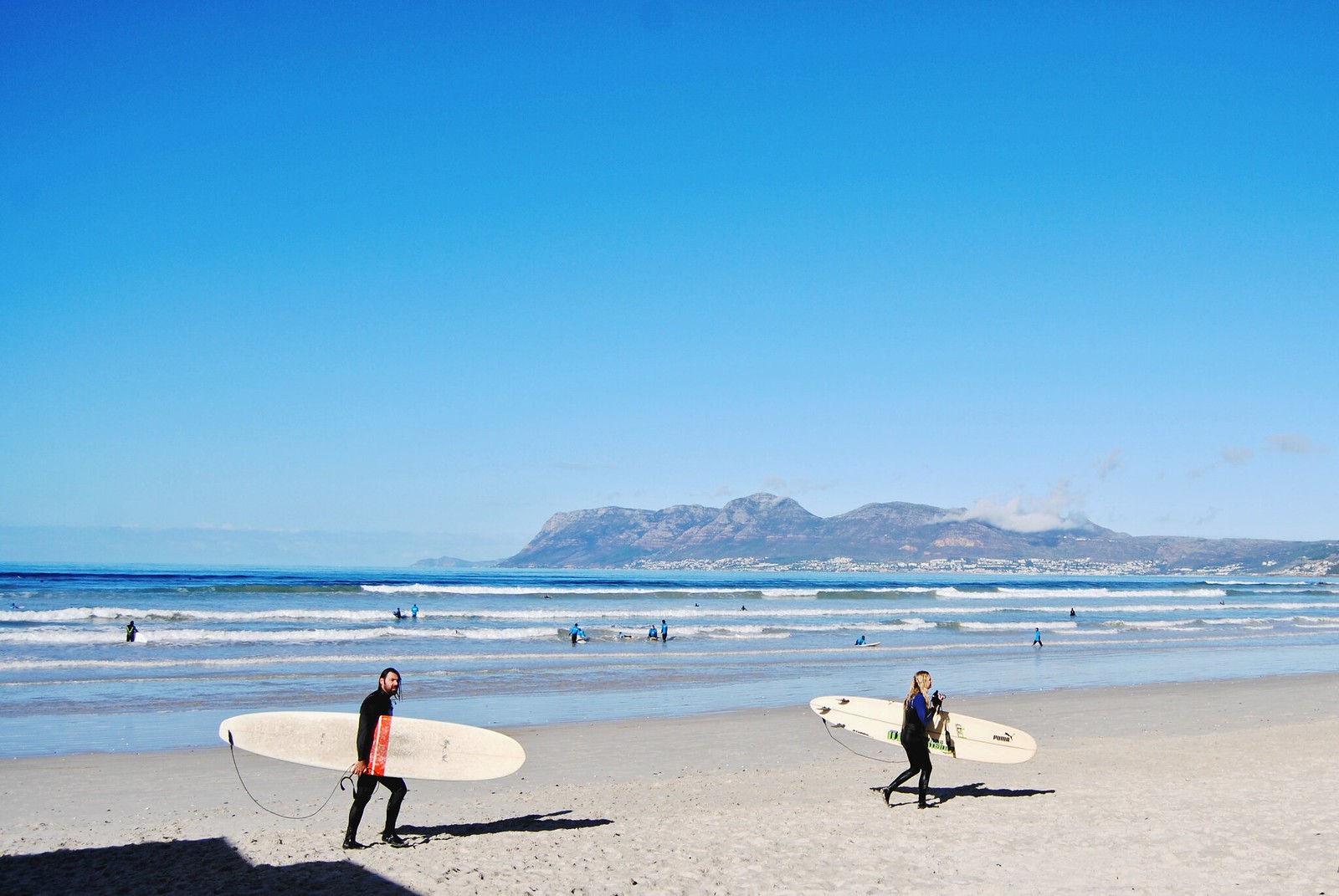 Surfing at Muizenberg Beach, South Africa.