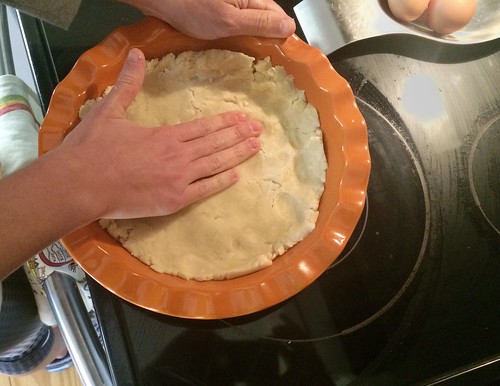 patting in the pie crust for chocolate chess pie