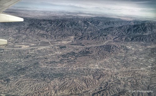 above travel blue sky terrain cloud holiday mountains building green window nature field weather plane airplane landscape fly nokia losangeles high airport day ray looking view desert bright earth aircraft aviation flight wing lakes houston atmosphere sunny aerial hills airline rivers land layer phonecamera airliner stratosphere birdeye lumia1020 nokialumia1020