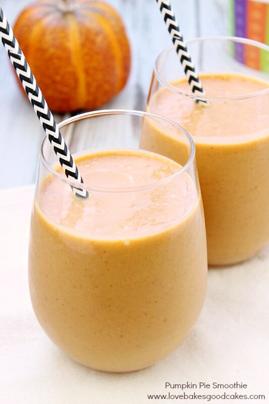 Pumpkin Pie Smoothie in clear glasses with straws.