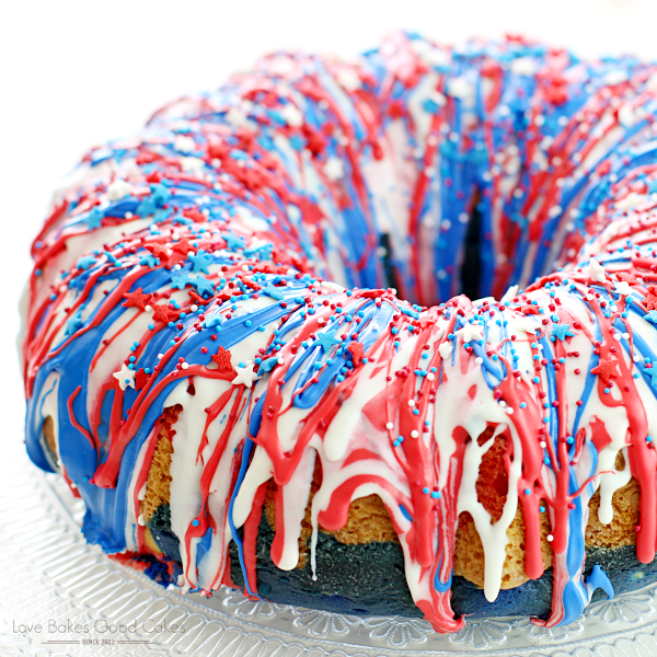 Firecracker Cake on a cake dish with red, white and blue frosting.