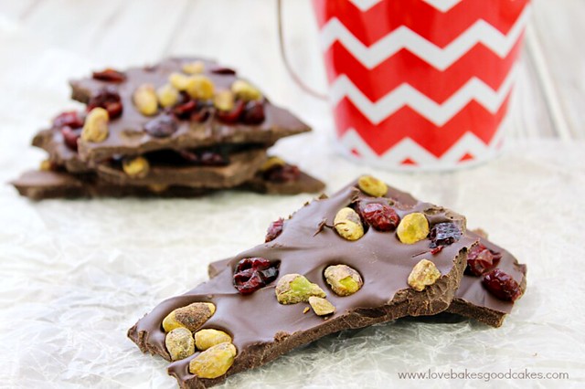 Pistachio & Cranberry Bark stacked up on parchment paper.