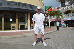 Ryan Janek Wolowski waving The flag of Saint Kitts and Nevis in the capital city of Basseterre, on the island of Saint Kitts