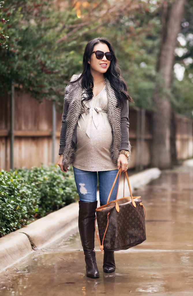 cute & little blog | petite fashion maternity | variegated peacock fur vest, cardigan, gold bow top, distressed jeans, kors otk boots, louis vuitton neverfull | fall winter layering outfit