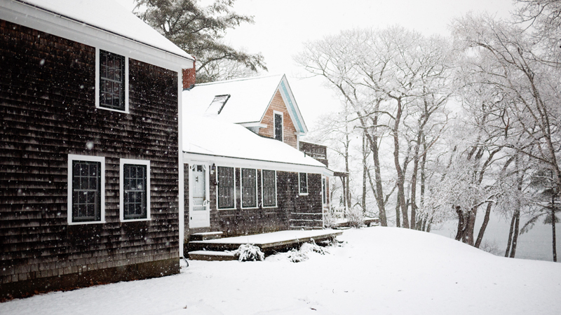 Family Maine Home Covered in Snow