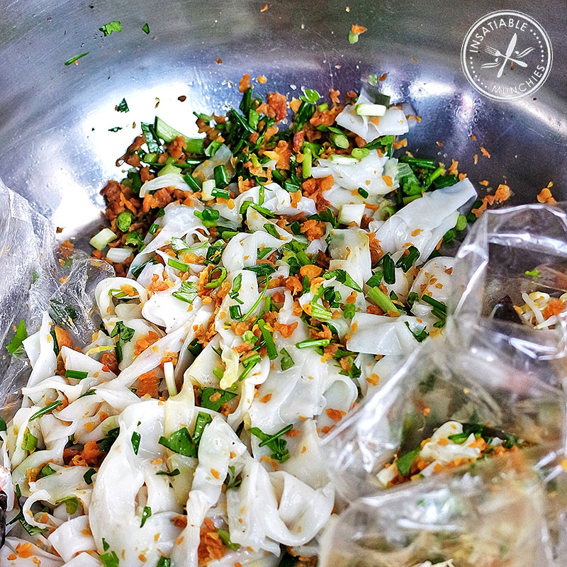 Rice noodle salad being made