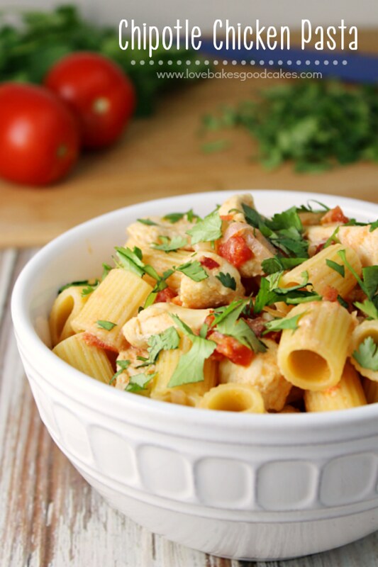 Chipotle Chicken Pasta in a white bowl with tomatoes.